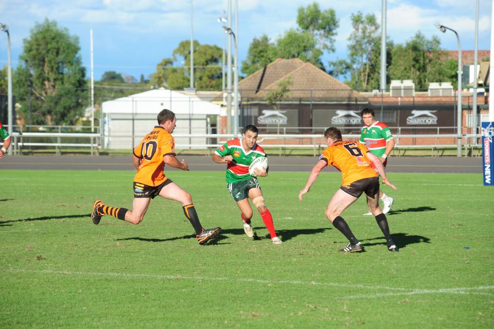 Nyngan s defence converges on Robbie Fuller.
