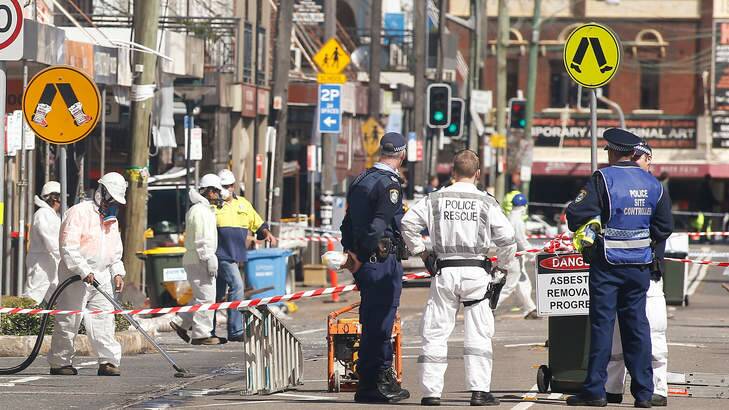 Asbestos removalists work at the scene of the explosion in Rozelle. Photo: Daniel Munoz