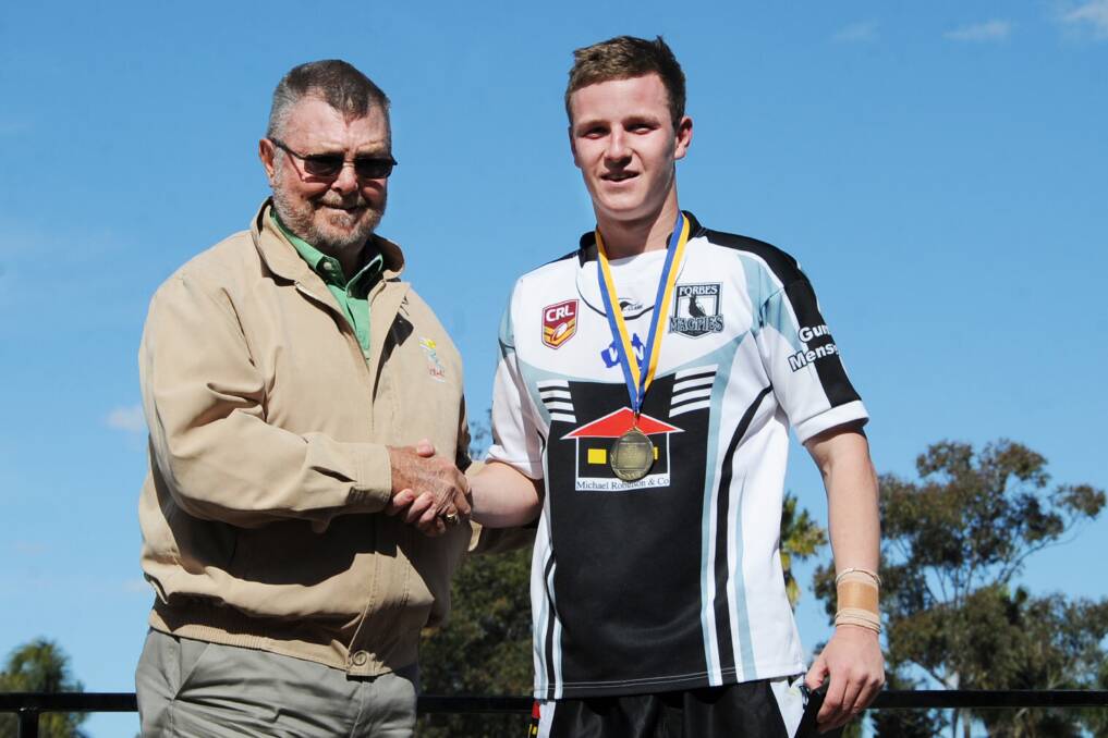 Nick Greenhalgh being congratulated by Tom Gray of Dubbo RSL Memorial Club after winning the under-18s man of the match and player of the year awards.  
Photo: Belinda Soole