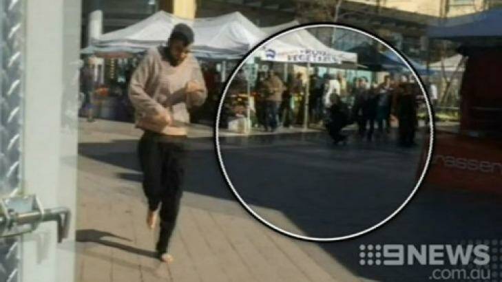 Alleged knife attacker Jerry Sourian at Westfield Hornsby with an injured bystander in the background. Photo:  Photo: Channel 9