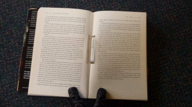 The mobile phone was found in the spine of the book. Photo: Corrective Services NSW