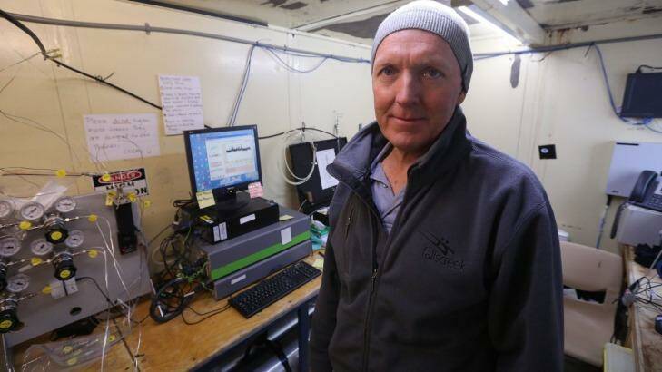 David Etheridge, from CSIRO's Oceans & Atmosphere division, at work in a research hut near the Antarctic base of Casey. Photo: Colin Cosier