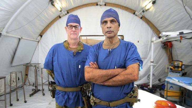 General surgeon and burns specialist Michael Rudd and orthopedic surgeon Major Jay Dave are both based at the medical facility at Camp Taji, Iraq. Photo: Gary Ramage
