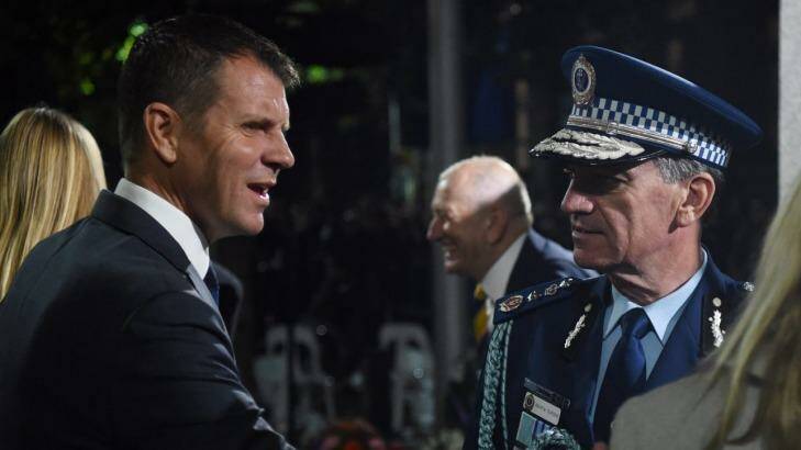 Police Commissioner Andrew Scipione - at the Anzac Day Dawn Service with NSW Premier Mike Baird on Monday - announced the arrest shortly after the service began. Photo: Nick Moir