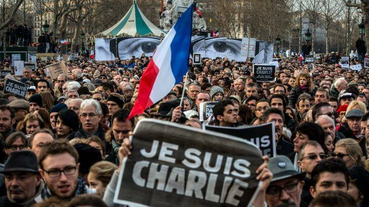 Thousands gather in Paris for a solidarity march with victims of the Charlie Hebdo massacre. The attack has sparked new calls to bolster the right to free speech in Australia.  Photo:  David Ramos