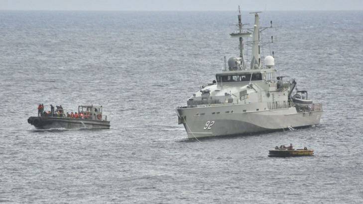 A Royal Australian Navy ship takes part in an effort to rescue suspected asylum seekers off Christmas Island in June 2012. Photo: Scott Fisher