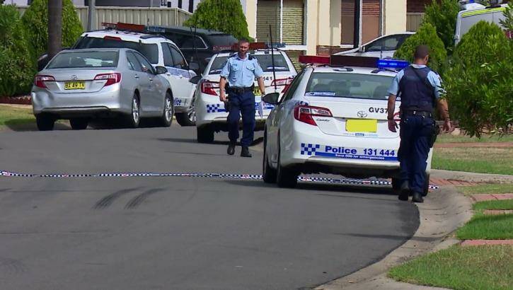 NSW Police at a house in Athlone Street, Cecil Hills, where a 54-year-old woman was found suffering from serious head injuries. Photo: TNV screengrab