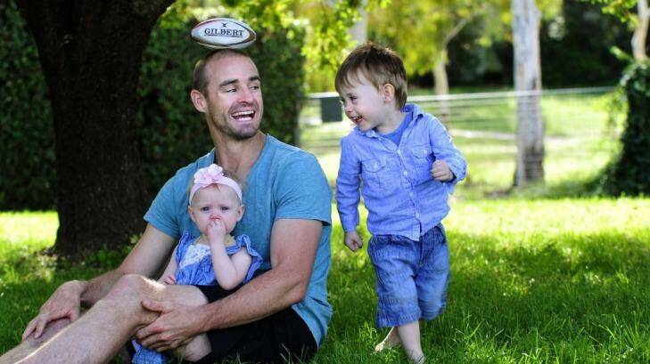Former Raiders and Manly winger Michael Robertson has retired due to injury. He is back in Canberra, with children Kobe, 2, and Emily 1. Photo: Melissa Adams