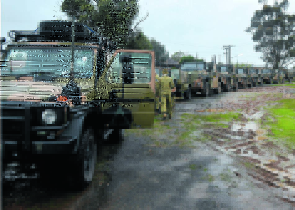  The convoy of Army vehicles prepares to leave the Parkes Showground over the weekend.  