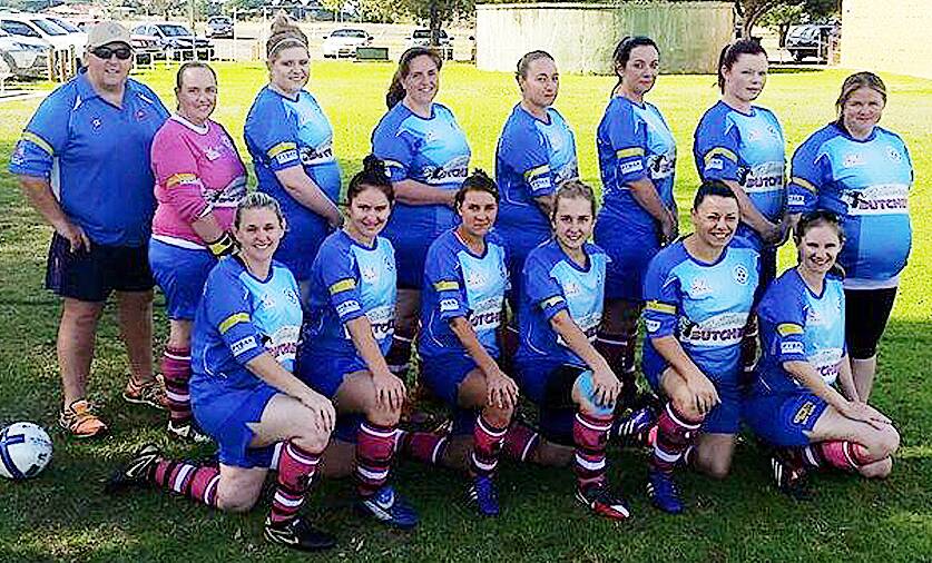 Services Swifts displayed their support for Stephanie Scott by wearing yellow armbands and their McGrath Foundation pink socks. Pictured are, back from left - Glen Harbidge, Mary-Anne King, Maddie Gilliver, Jacky Maxlow, Jamie Leonard, Anna Kliese, Teisha Harding and Ness Edwards; front – Maree Harbidge, Anita Kealley, Becca Athey, Claire Ford, Stacey Nash and Bec Jones. sub
