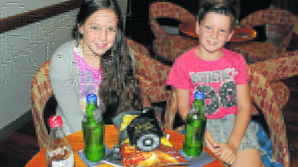 PICTURED - Maely and Sonny MacGregor went over from Parkes to see Hotel Transylvania II at Forbes Services Memorial Club’s new cinema and stocked up on snacks while waiting to go in. 0116cinema(3)

