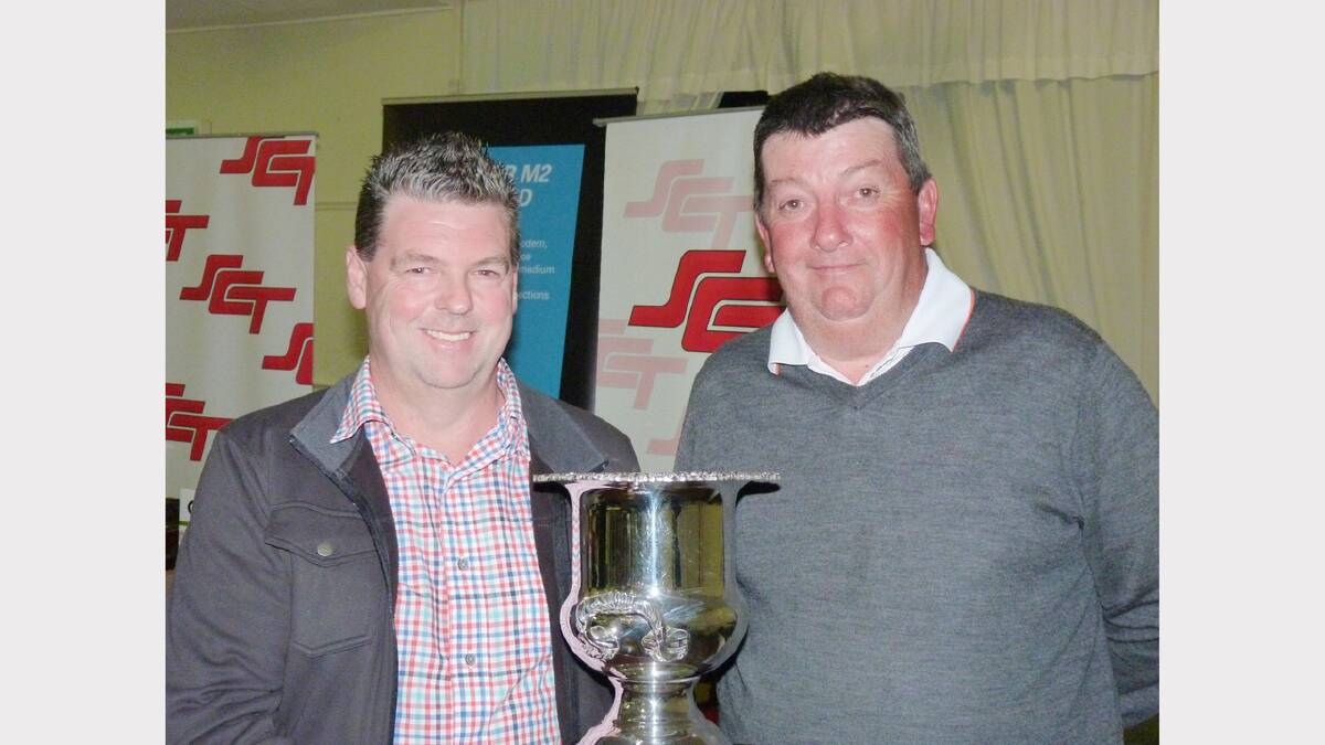 SCT Logistics NSW Manager Jason Bovis presented the Parkes Open trophy to Robert Payne last year. sub