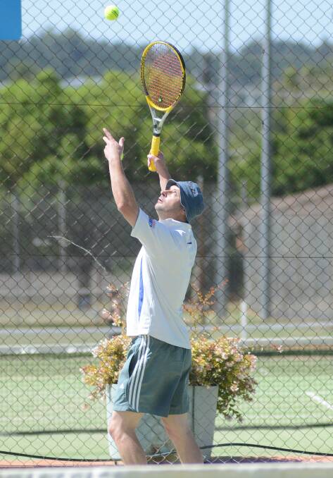 Geoff Leonard in action at Parkes tennis courts yesterday. 