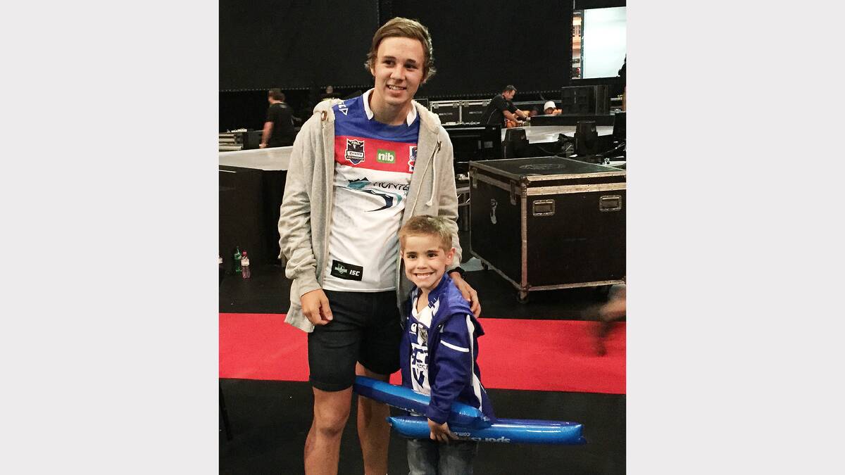 Pictured is Jesse Parker, winner of the Opens League Of Their Own, and the Junior winner, “William” at the Footy Show grand final at Sydney Entertainment Centre. 
