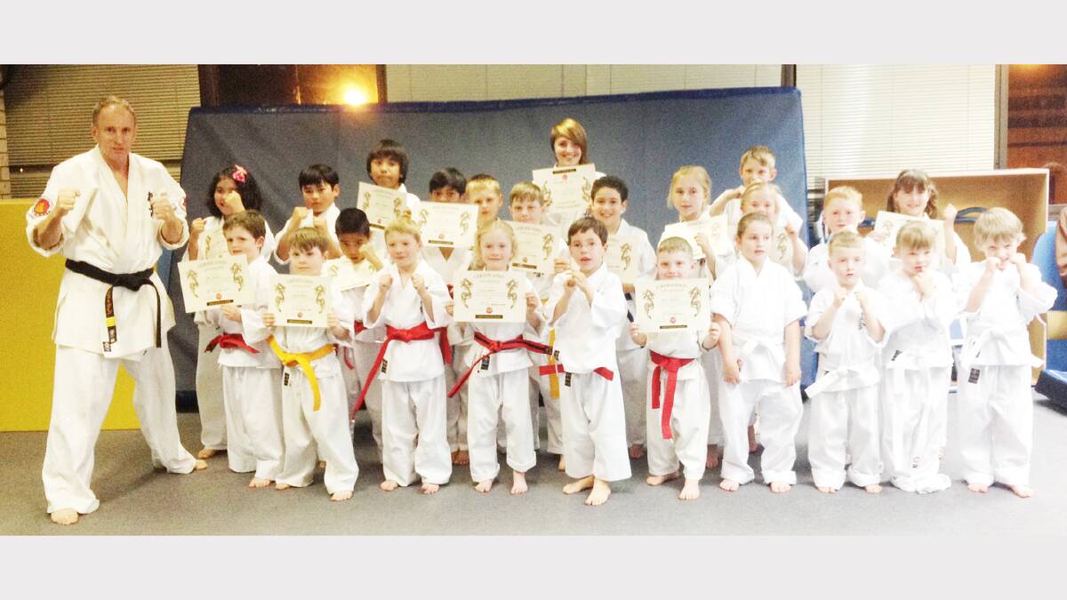 Little Samurais proudly displayed their certificates from the recent gradings. sub