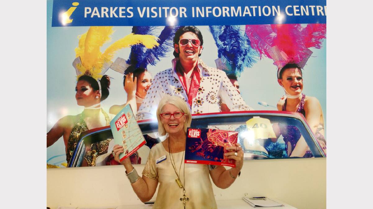 Parkes Visitor Information Centre assistant, Sharon Klarner with the new Elvis Festival program.