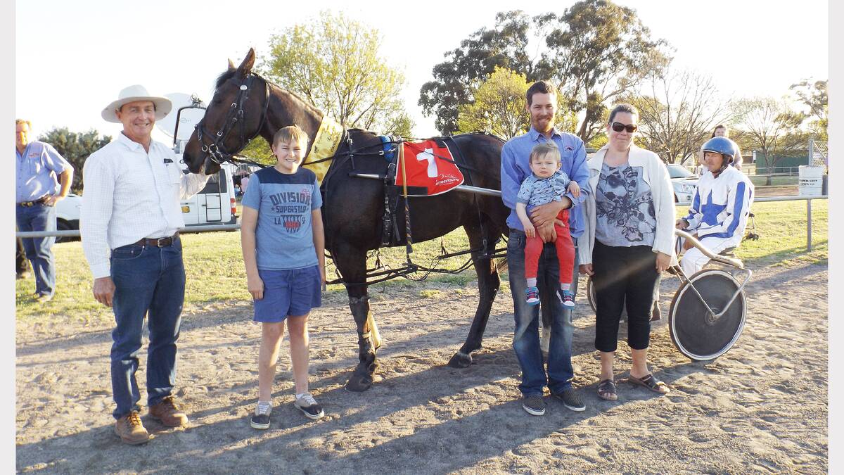 Poppy Cee pictured after winning Heat 5 of the Canola Cup with, from left - owner Geoff Cole, strapper Will Cassell, Phil Cole holding son Elijah, Jessie Cole and trainer-driver Andrew Cassell. sub