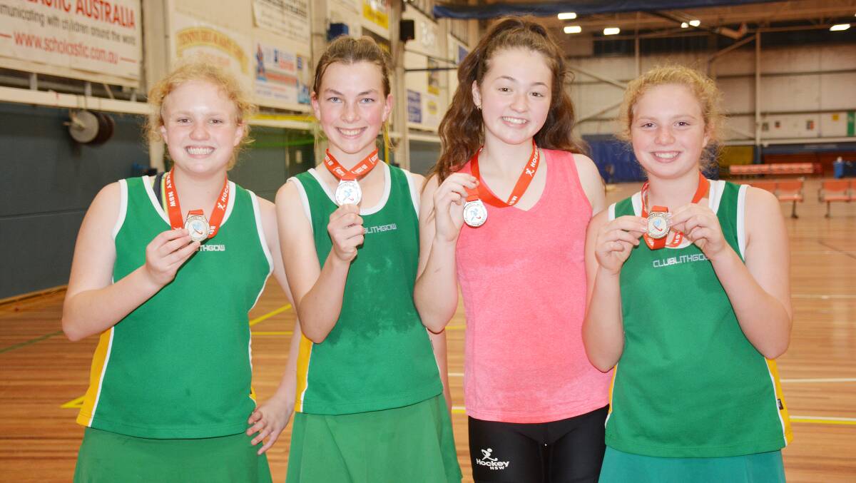 The four Parkes girls proudly displaying their gold medals, from left - Maggie Wright, Savannah Draper, Gracey Denham-Jones and Sophie Wright. sub