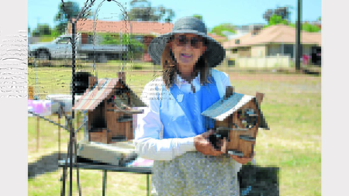 PICTURED is Nina Boulton from West Wyalong with her bird houses.    Photo: Renee Powell.