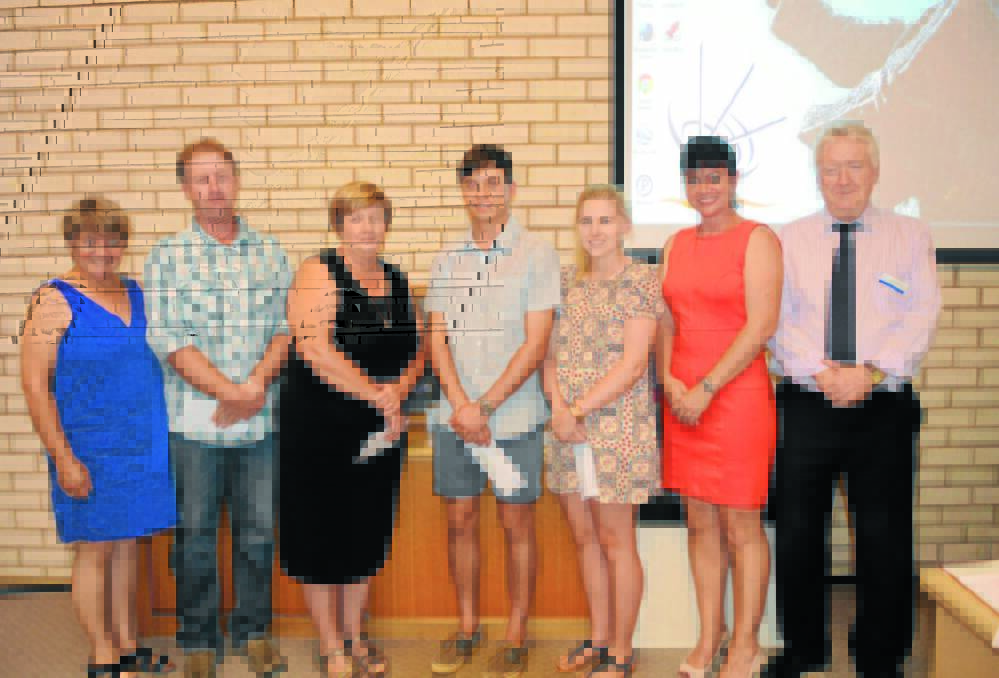 The presentation of the Jack Scoble scholarships at Tuesday’s Council meeting, from left Councillor Barbara Newton, Brett Davis (receiving on behalf of his daughter Lauren), Ellen Hart (receiving on behalf of her daughter Amy), Vince Umbers, Illie Hewitt, Councillor Belinda McCorkell and Councillor Michael Greenwood OAM.                                                                                                                                Photo: Renee Powell 