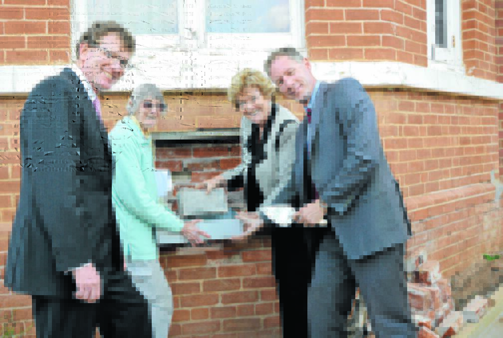 Pictured removing the time capsule placed in the hospital wall back in 1904 are from left, local state MP, Andrew Gee, Yvonne Hutton (granddaughter of the Hospital Chairman at the time, John Medlyn, Minister for Health, Jillian Skinner, and Scott McLachlan (Chief Executive Officer of the Western NSW Local Health District).  
During the capsule removal, Mrs Hutton revealed that the hospital was originally built for 2,636 pounds.  She also produced an historic enscribed trowel which was used with the laying of the foundation stone.  It was missing for many years and only returned to the hospital by a gentleman from England who found it at a church fete.  Mr McLachlan is holding the trowel in the picture. Photo: Roel ten Cate. 