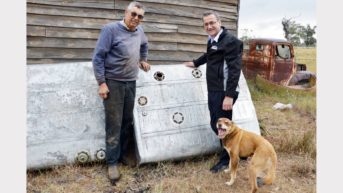 Goonumbla farmer Edwin Nash was only too happy to hand over the two fuel tanks of the World War II Beaufighter aircraft to enthusiast Grant Coles.                                                                  Photo: Bill Jayet 
