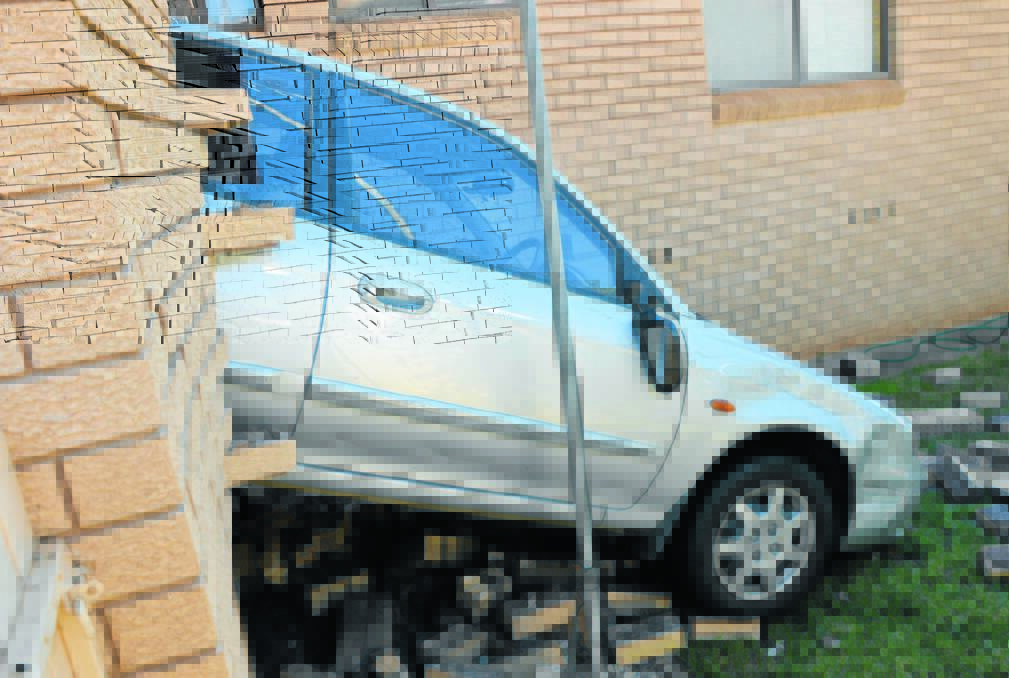 The scene of the accident on Wednesday morning where  fortunately the garage wall of this home in Jubilee Street was the main 'victim'. Photos: Bill Jayet