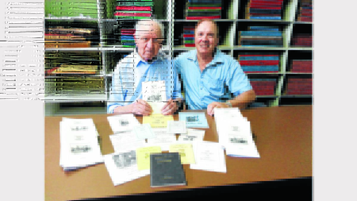 Len Unger with nephew Don Unger and some of the books he has produced.