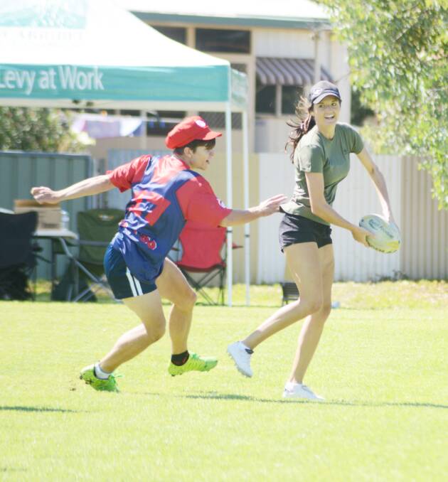 Shayna Male (right) evaded a Wagga “Mario Bros” player at the carnival last Saturday.
Photo: Renee Powell 0214touch_8536