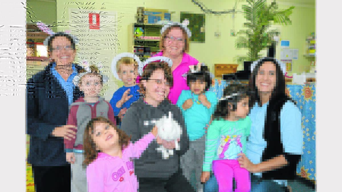 Pictured at PECC this week in the Sunshine Room were (left to right) Michelle Allan, Asher Gould, Anderson Ball, Emma Sinclair (holding the rabbit), Sue Tait, Ronna Sanie, Vanessa Dun with Tracey Lee. In front patting the cute little bunny, Ollie,  is Isabella Da Silva.   Photo: Bill Jayet