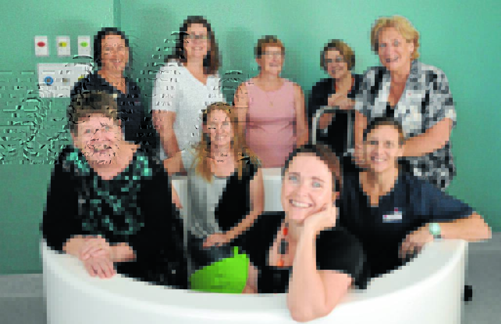 Local midwives are excited about the new service - back - Susan Pearce, Nicky White, Pat Hele, Barbara Stoakes, Cath Ryan; front - Kate Blackwood, Julianne Ball, Cath Byrnes and Tanya Bayliss. Photo: Bill Jayet.