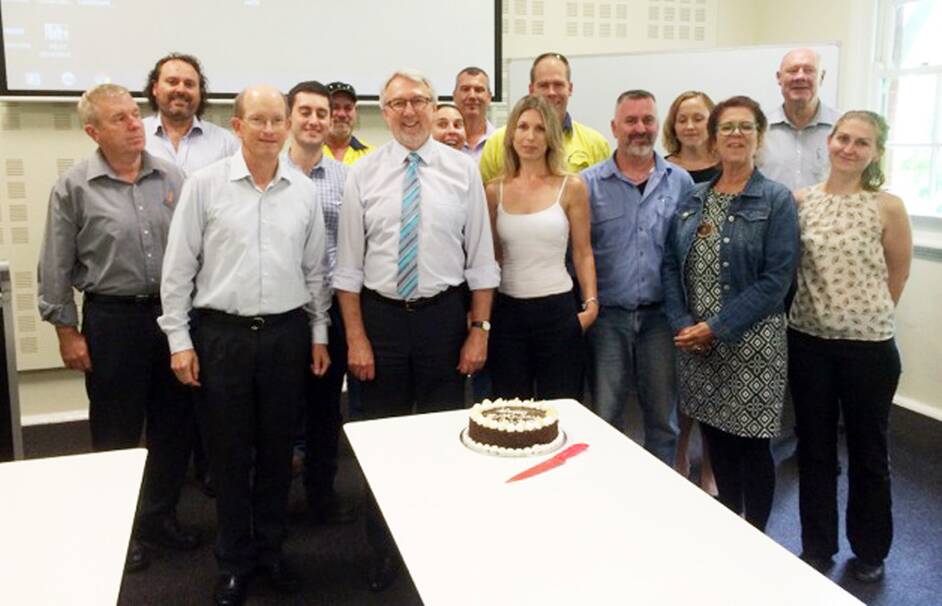 NetWaste Steering Committee members celebrated the 20th birthday milestone with a cake at Dubbo City Council, from left - Michael McCulloch (Dubbo City Council), Wayne Davis (Orange City Council), Steven Clayton (Dubbo City Council), Leon Ross (Forbes Shire Council), Chris Manoel (Broken Hill City Council), Steven Campbell (NetWaste Executive Officer and Parkes Shire Council), Elizabeth Guest (Broken Hill City Council), Lindsay Mathieson (Gilgandra Shire Council), Antony Cullen-Ward (Bathurst Regional Council), Simmone Kalanj (NetWaste), Craig Lynch (Cowra Shire Council), Kayla Volker (Bogan Shire Council), Sue Clarke (NetWaste), Roy White (Walgett Shire Council) and Alexandra Carynny (Mid Western Regional Council). 