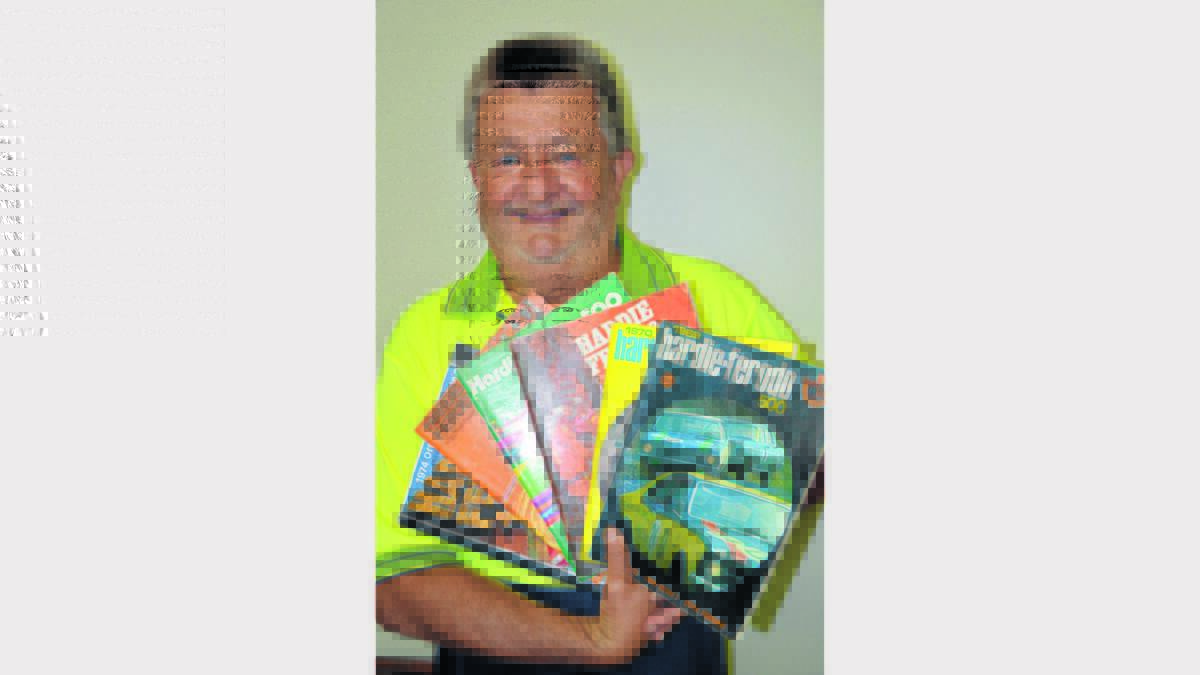 Darcy Emmanuel with some of the many Bathurst Race programs he has, dating back some 40 years. Photo: Roel ten Cate