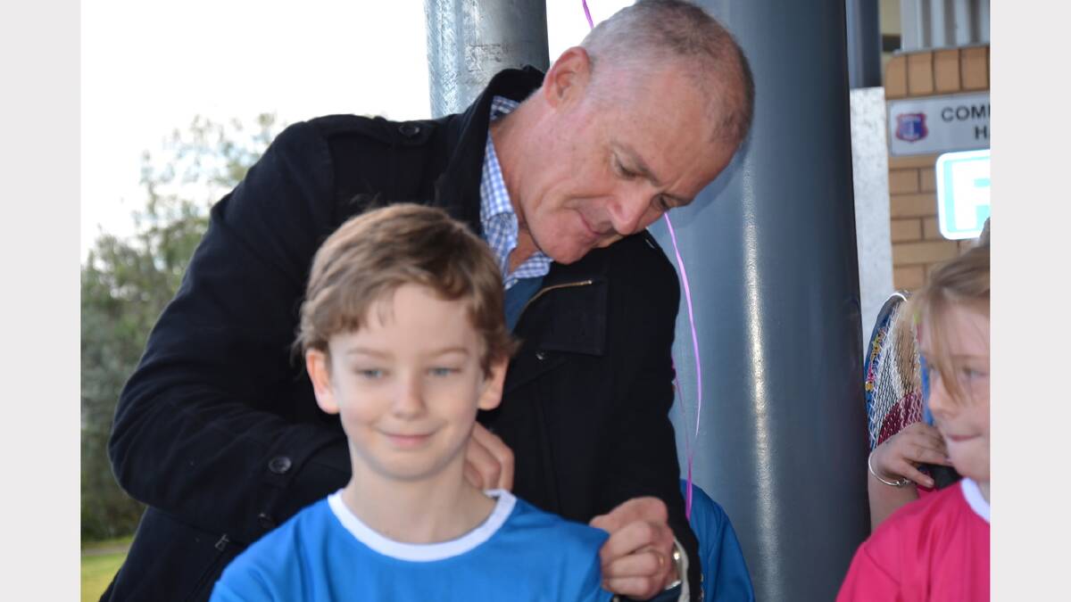 One highlight of Parkes Public School's tennis activities was the visit of John Fitzgerald. He was pictured here signing Jacob Berry's Hot Shots shirt.