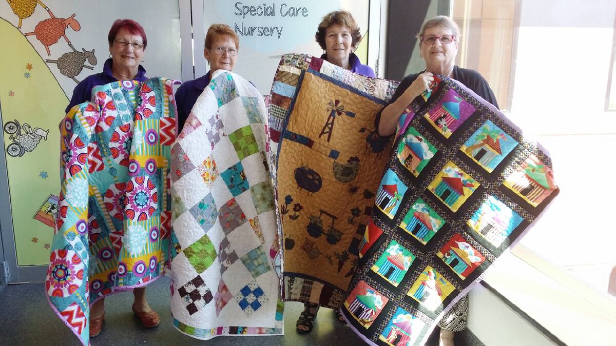 Colleen Flynn, Beverley Purcell, Barbara Thompson and Beverley Thompson travelled to Canberra to deliver the quilts.    