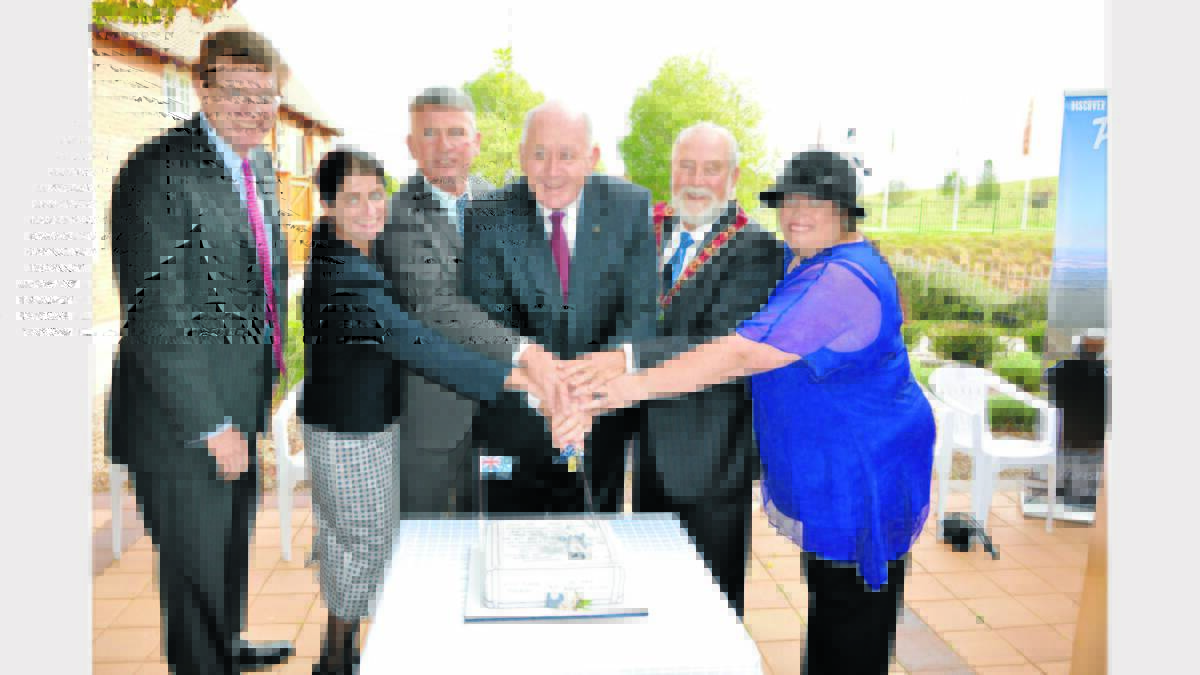 Member for Orange Andrew Gee, Kate Petty and husband Cr Peter Petty (Tenterfield Mayor), Governor General Sir Peter Cosgrove, Parkes Mayor Ken Keith and Sue Keith cut the 
Sir Henry Parkes celebration cake, that was made and decorated by Kath Swansbra.  
