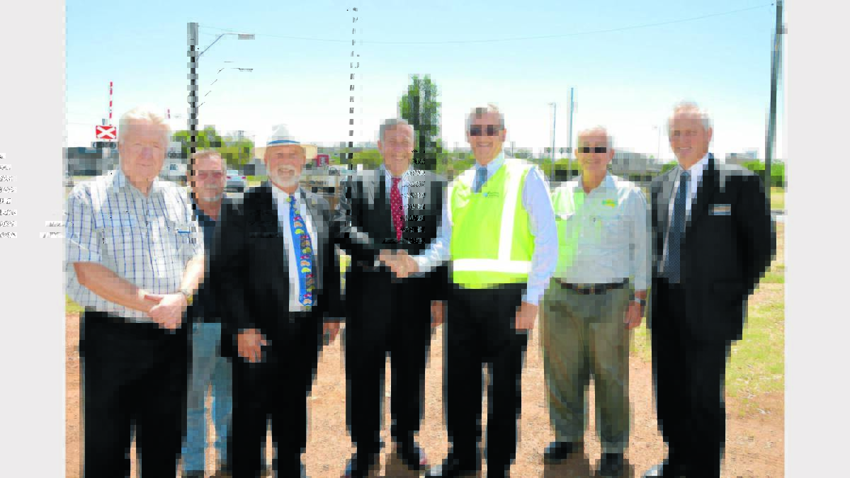 Pictured delighted with Wednesday’s announcement of $50 million for a highway by-pass around Parkes are from left, councillors Michael Greenwood, George Pratt, Mayor Ken Keith, Roads Minister Duncan Gay, Western Region RMS Manager, Phil Standen, Cr Bob Haddin and Parkes Shire General Manager, Kent Boyd. 