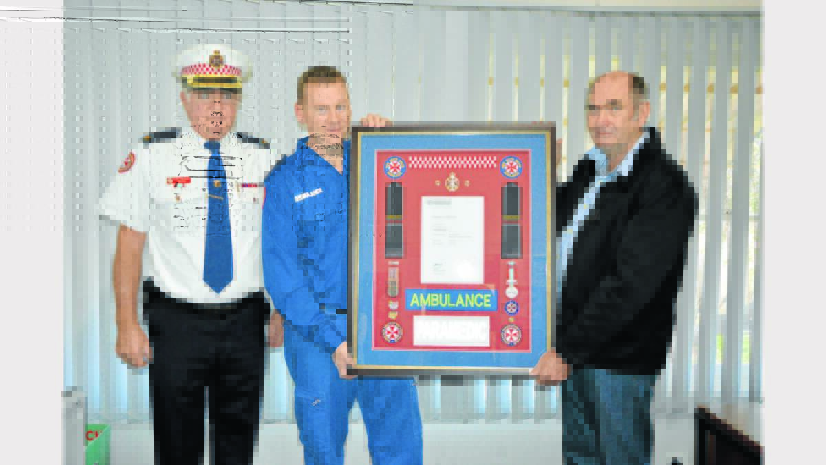 Noel (right) is pictured with Inspector Peter Rowlands, and Mark Smith (Parkes Station Manager).  Photo: Barbara Reeves