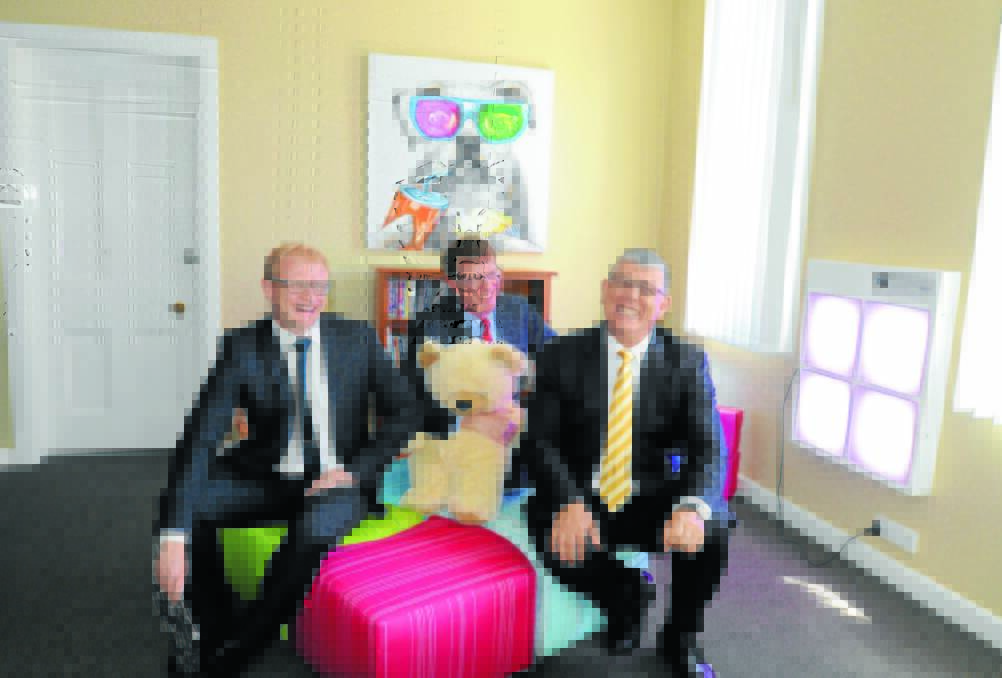 HELPING PARENTS AND CARERS BEAR UP: CareWest chief executive officer Tim Curran, member for Orange Andrew Gee and NSW Minister for Disability Services John Ajaka in one of the recreation rooms for children with a disability. Photo: JUDE KEOGH   