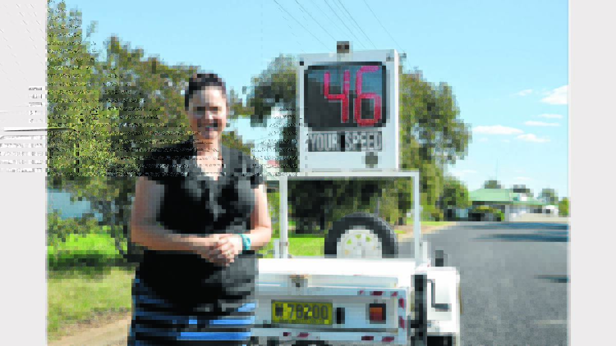 Road Safety Officer, Melanie Suitor, with the monitor in Victoria Street.