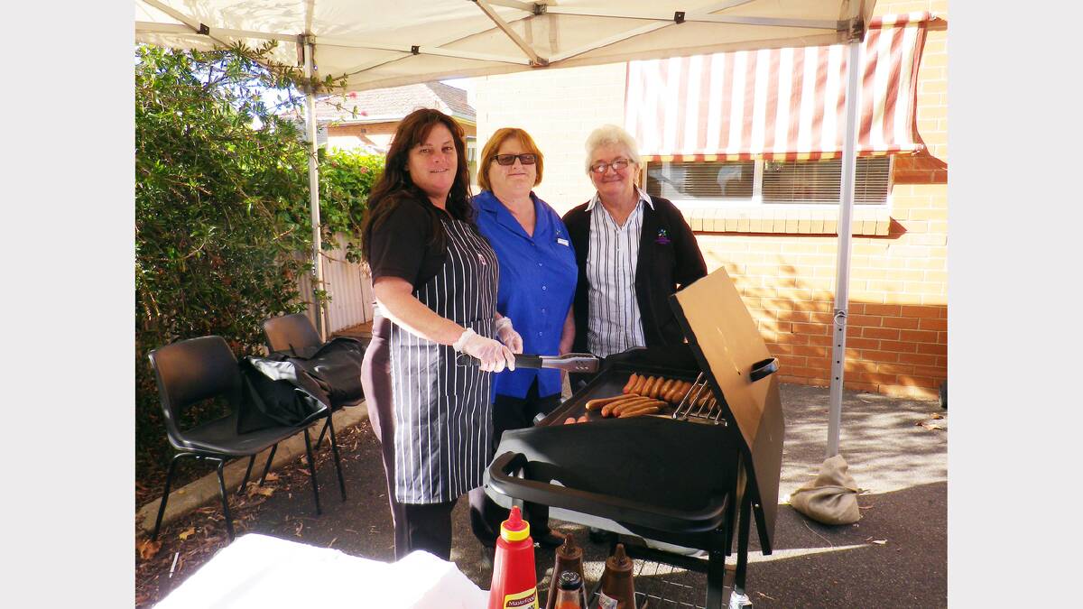 Tina Nash, Tracey Dumensy and Marg Thurn are pictured cooking the barbie at last year’s open day at the Parkes Neighbourhood Centre.