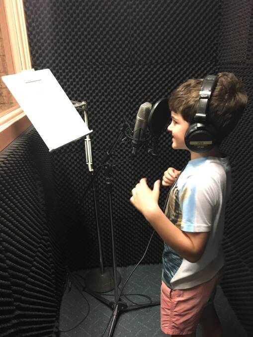 DISC JOCKEY: Finlay Quince enjoyed attending the 2PK recording studio to record short rhymes for airplay as part of the Paint Parkes REaD with Friends promotion. Photo: Supplied. 