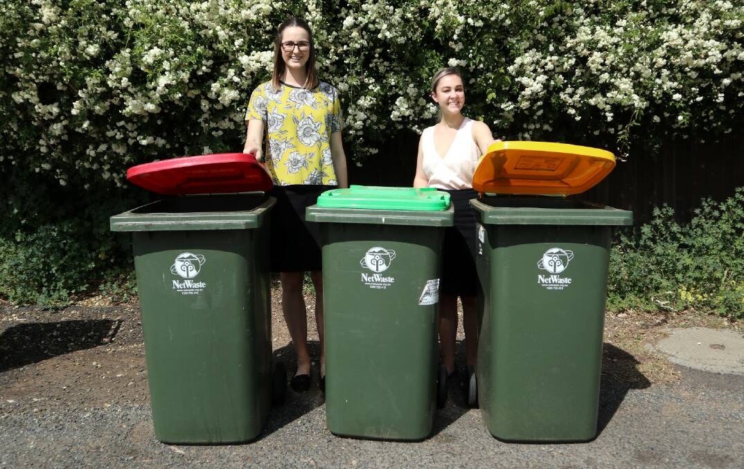 GOOD RESULTS: Parkes Shire Council staff Emily Jones and Jemima Hilder are encouraging residents to be mindful when using the three bin system to avoid contamination.  