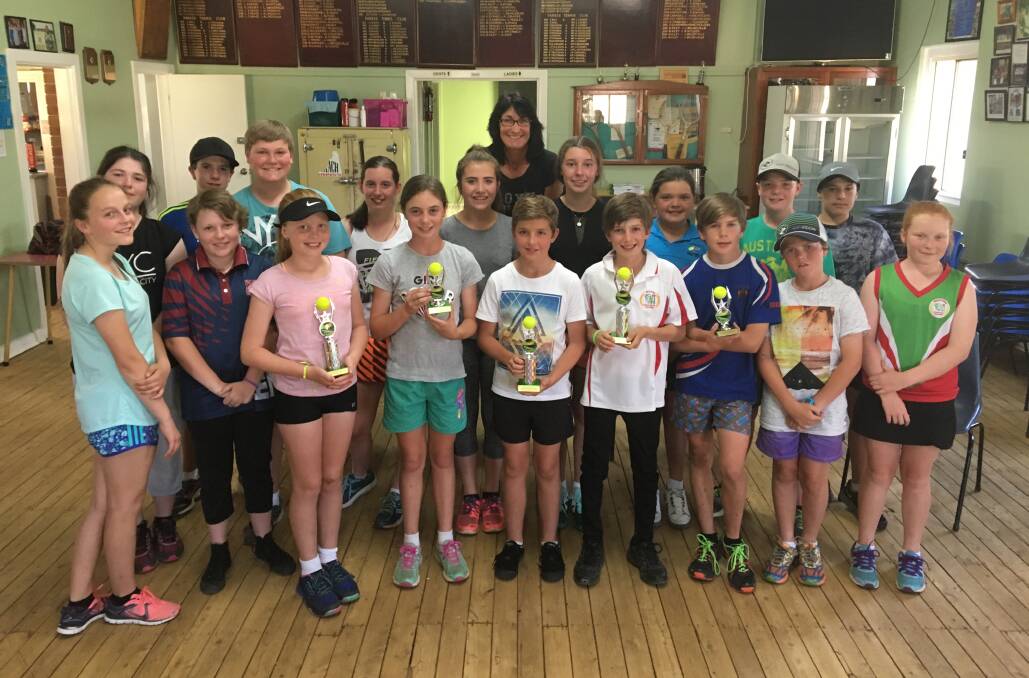 JUNIORS: Parkes junior tennis players with coach Helen Magill at the singles and doubles junior competition presentations.