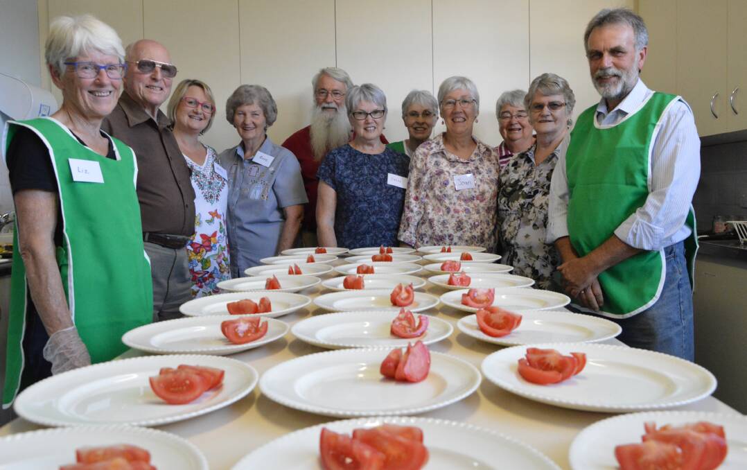 CHRISTMAS FEAST: Parkes Uniting Church volunteers prepared their last free evening meals for 2017 on Monday, December 4, catering for 80 people. From left are Liz MacRaild, Ken White, Mel ten Cate, Anne Wright, Graeme MacRaild, Jan Ladbury, Evelyn Shallvey, Joan Paul, Marie Weller, Adrienne Bradley and Peter Dearden. Photo: Christine Little