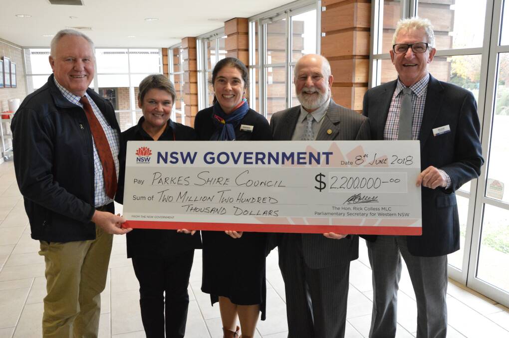 BIG BOOST: Parliamentary Secretary for Western NSW Rick Colless hands over $2.2 million to Cr Barbara Newton, Parkes library manager Shellie Buckle, Mayor Ken Keith OAM and Cr Bill Jayet.