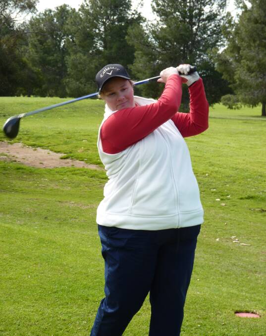 MAIDEN WIN: Parkes female golfer Cherrie Phillips drives during the final round on her way to victory in the ladies golf Parkes Club Championship.

