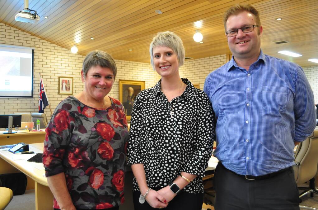 DAY TWO: Parkes Shire Council's new business support officer Sarah Coles (centre) mingled with deputy mayor Barbara Newton and Director of Infrastructure Andrew Francis at council's May meeting.