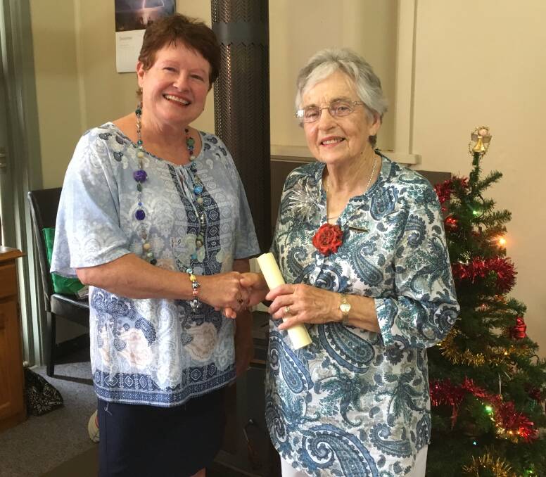 New Bogan Gate CWA president Marion McIntyre presented Margaret O’Connell with her long service bar after 20 years with the club.