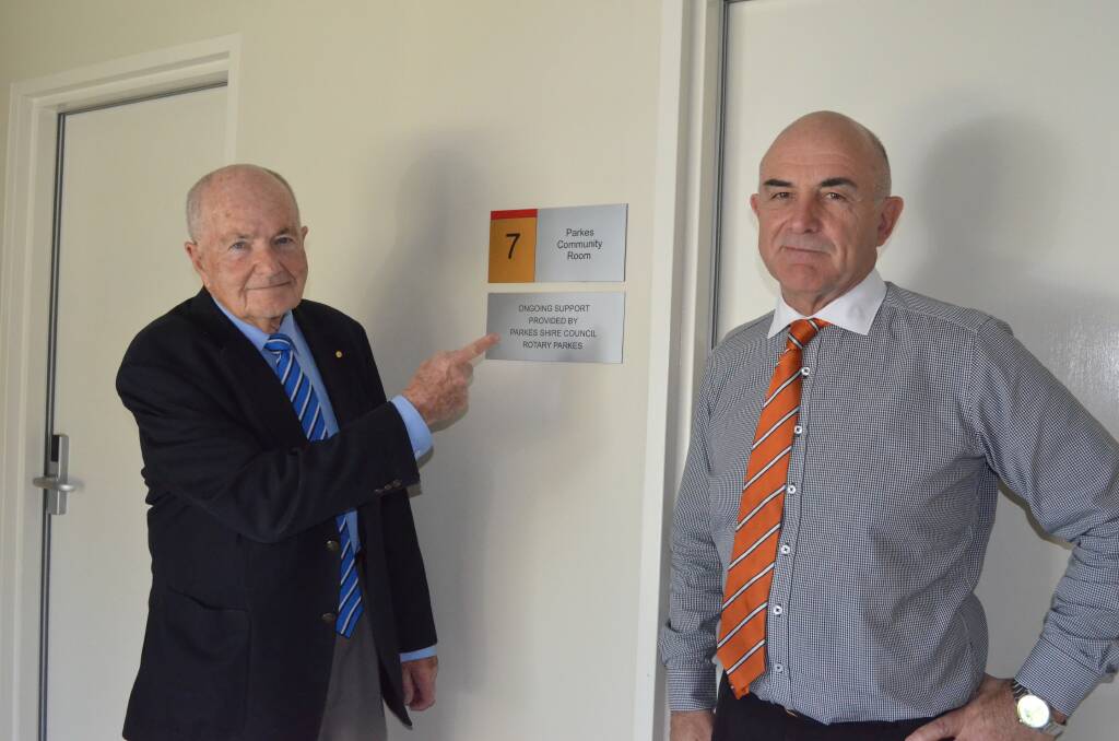 LOCAL SUPPORT: Cancer Care Western NSW vice chairman Dr Stuart Porges and chairman John Carpenter outside the Parkes-funded room at the Western Care Lodge.